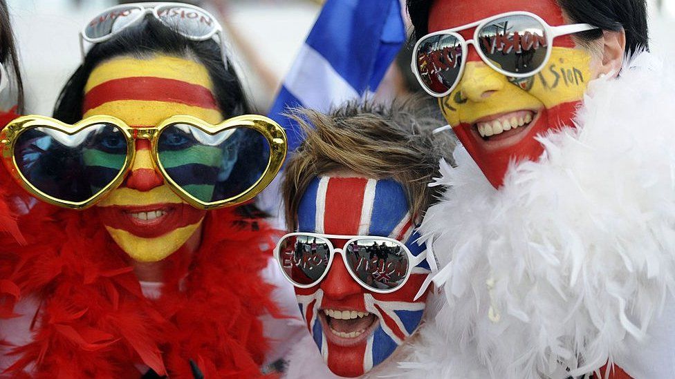Eurovision fans with faces painted to represent different countries' flags