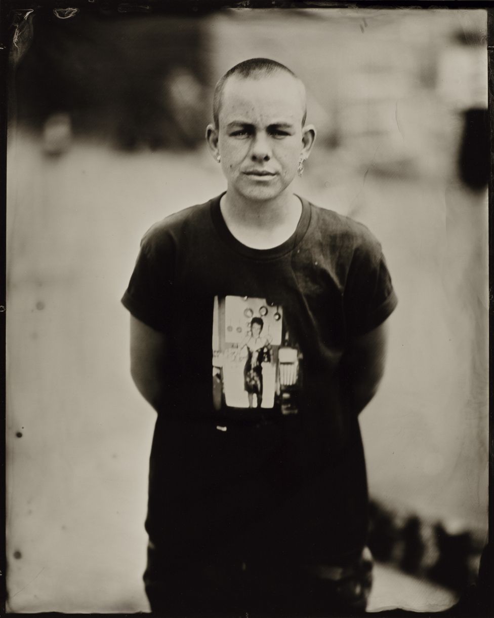 Portrait of a person wearing a dark t-shirt