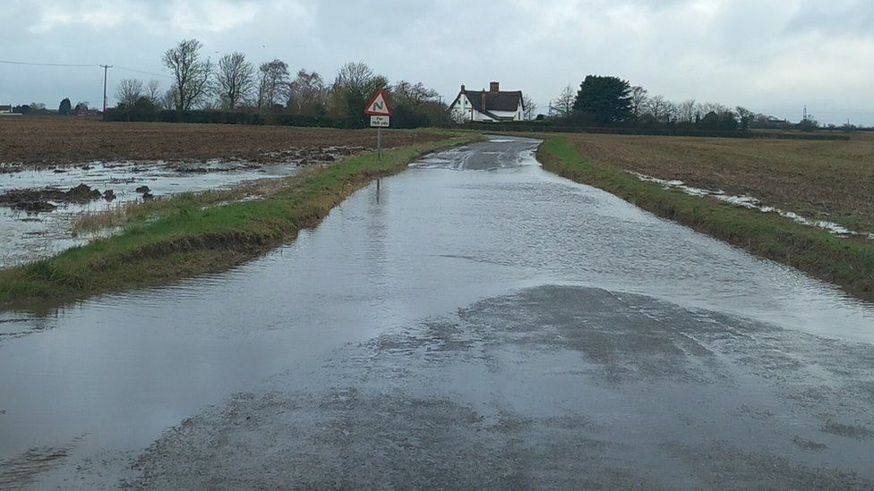 Flooded road in Mickfield, Suffolk