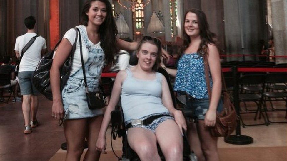 Three girls in the Sagrada Familia cathedral in Barcelona