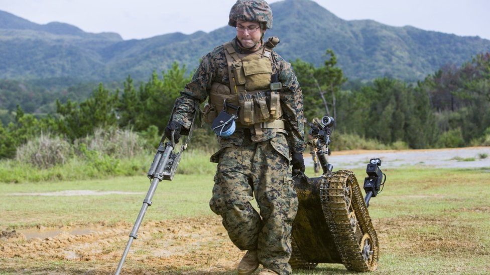 Solider dragging a robot