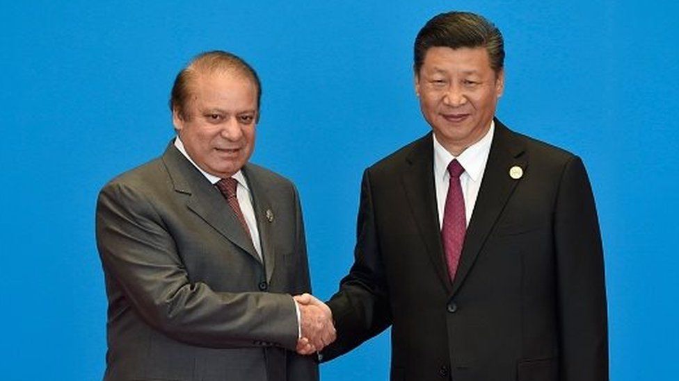 Pakistan's Prime Minister Nawaz Sharif (L) shakes hands with China's President Xi Jinping during the welcome ceremony for the Belt and Road Forum, at the International Conference Center in Yanqi Lake, north of Beijing, on May 15, 2017