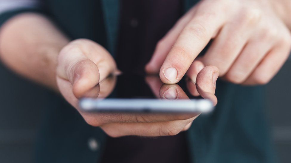 Man holding a mobile phone