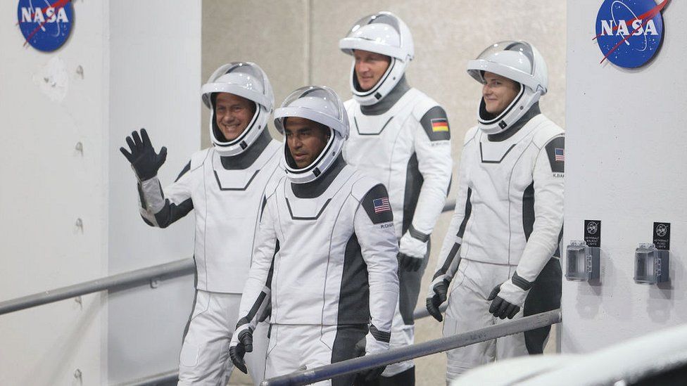 NOVEMBER 10: (L-R front) NASA astronauts Tom Marshburn and Raja Chari and (L-R back) European Space Agency astronaut Matthias Maurer of Germany and NASA astronaut Kayla Barron walk out of the Operations and Checkout Building on their way to the SpaceX Falcon 9 rocket with the Crew Dragon spacecraft on launch pad 39A at the Kennedy Space Center on November 10, 2021 in Cape Canaveral, Florida.
