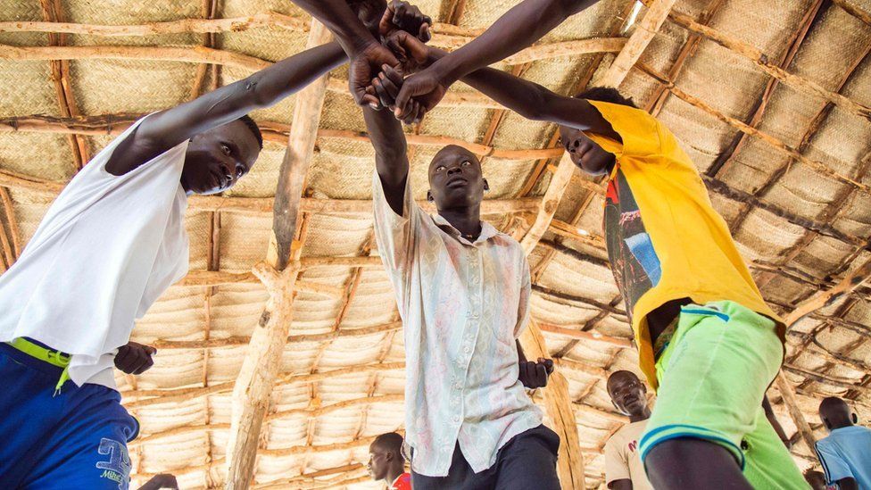 Young refugees from Sudan practice an activity on "trauma healing" at Doro refugee camp, in Maban, South Sudan, on May 3, 2017. The NGO Jesuit Refugee Service provides therapeutic activities for youth who have experienced critical experiences in conflicts, such as in the Blue Nile, in Sudan