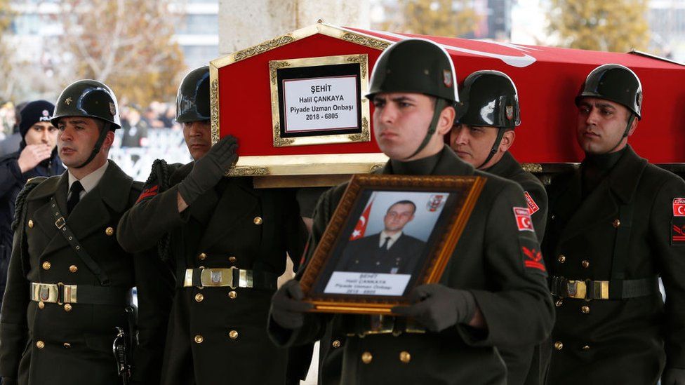 Mourners carry the coffin of a Turkish soldier Halil Cankaya killed in an air strike in Syria's Idlib