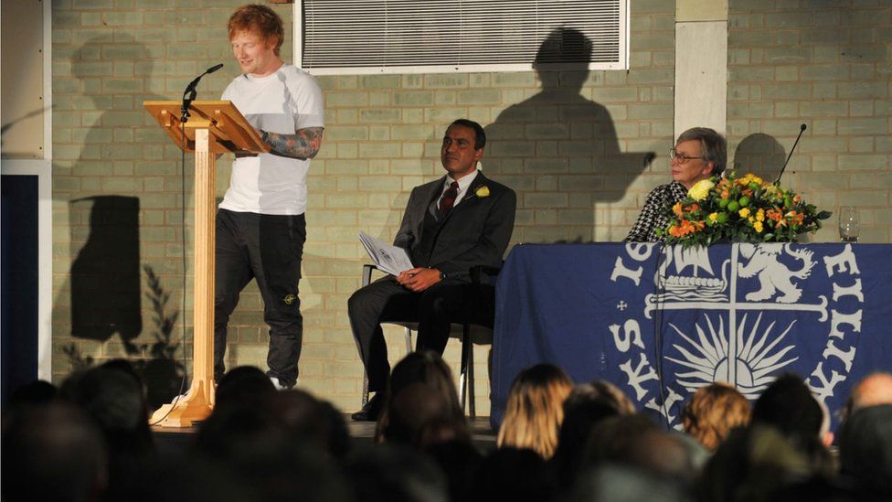 Ed Sheeran giving a speech at Thomas Mills High School's awards ceremony