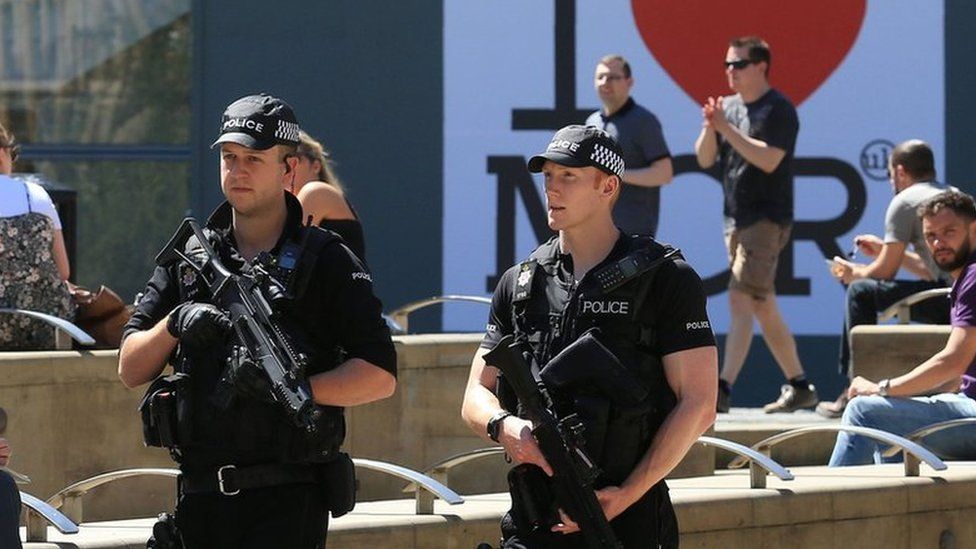 Armed police patrolling in Manchester