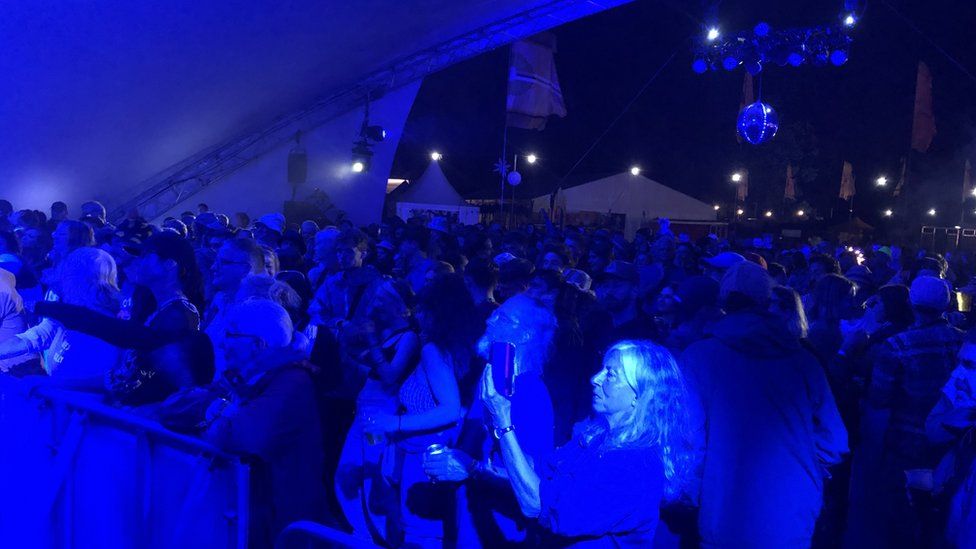 People in a crowded tent at Womad Festival