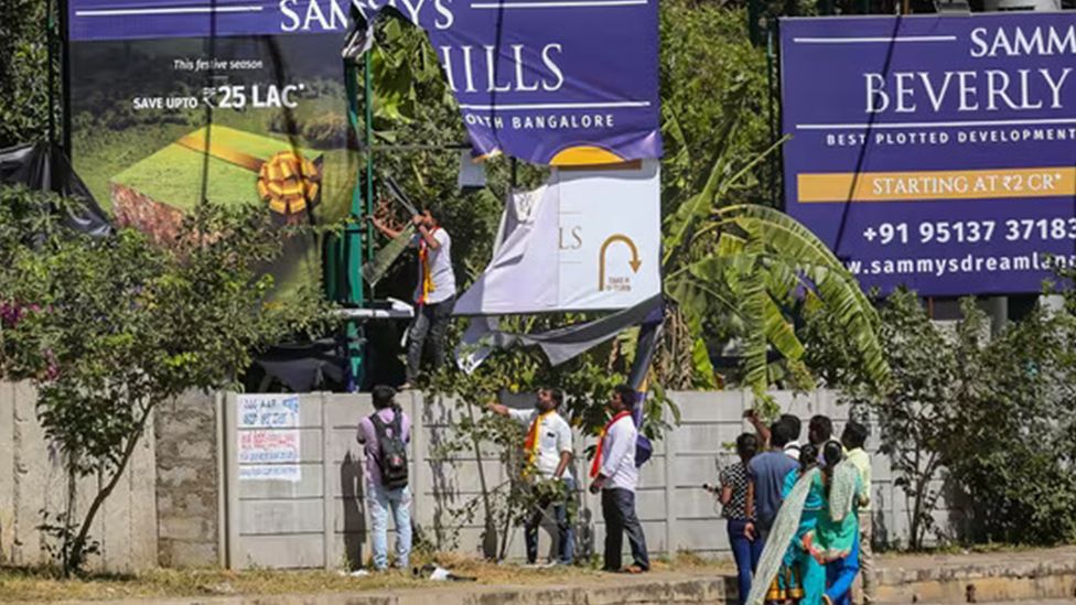 Kannada activists tore down an English signage in a protest held in December 2023