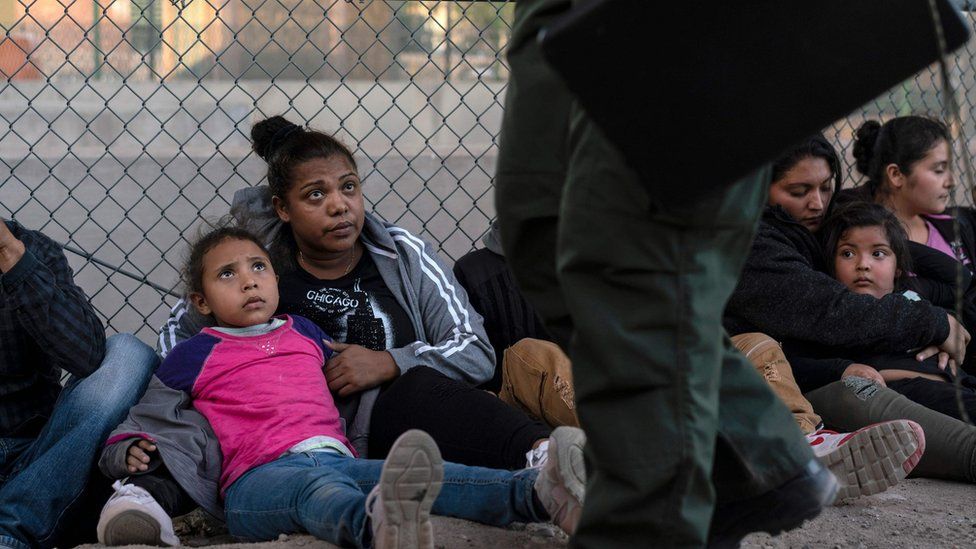 Migrants caught at the US border staring at CBP officers