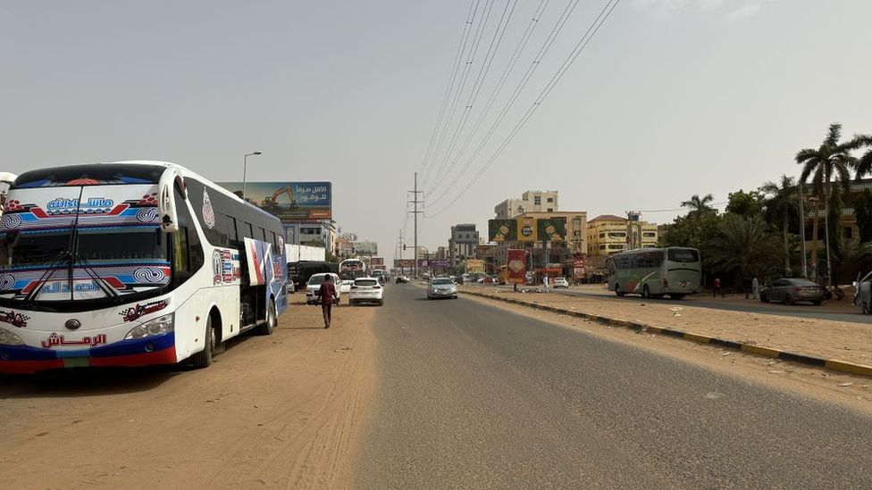 People evacuate Khartoum on Wednesday as a 72-hour ceasefire largely holds