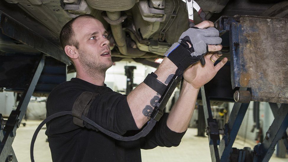 A man using Bioservo's Iron Hand