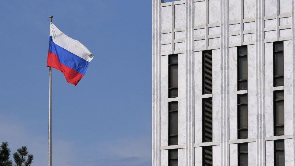 The Russian flag flies at the embassy's compound in Washington DC