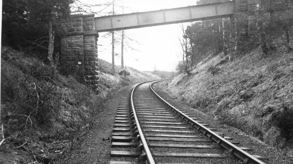 A black and white image of a railway track from the 1950s