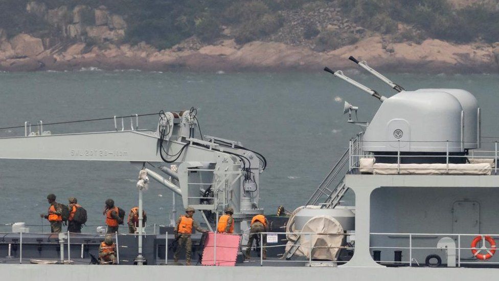 Soldiers on a Chinese warship near Taiwan