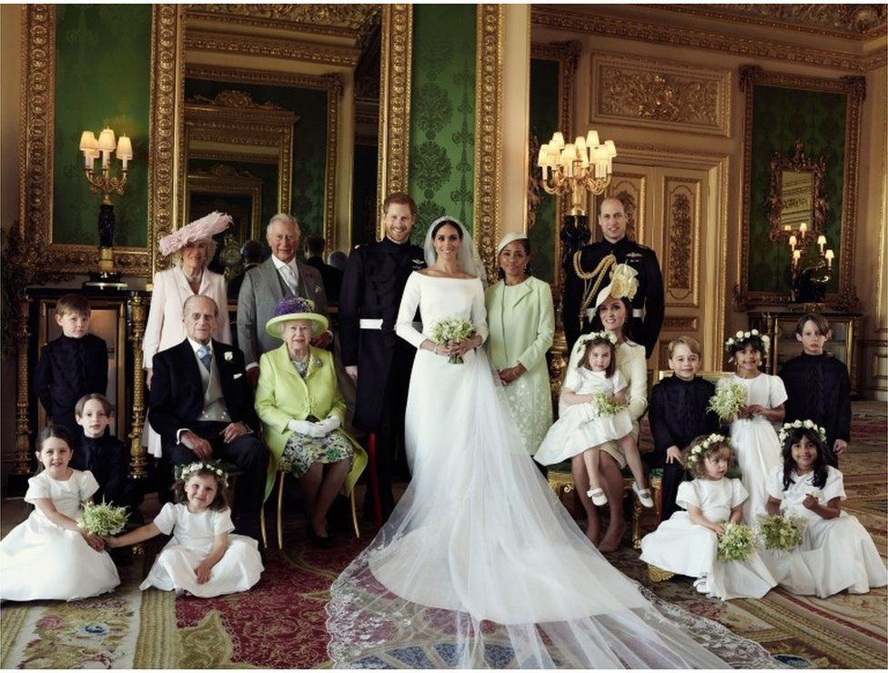 group photograph of Prince Harry and Meghan surrounded by family