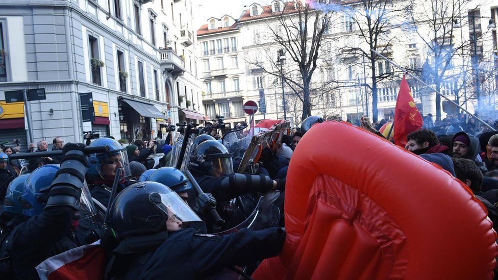 Protesters from anti-fascist groups clash with police during a rally in Milan, Italy, 24 February 2018