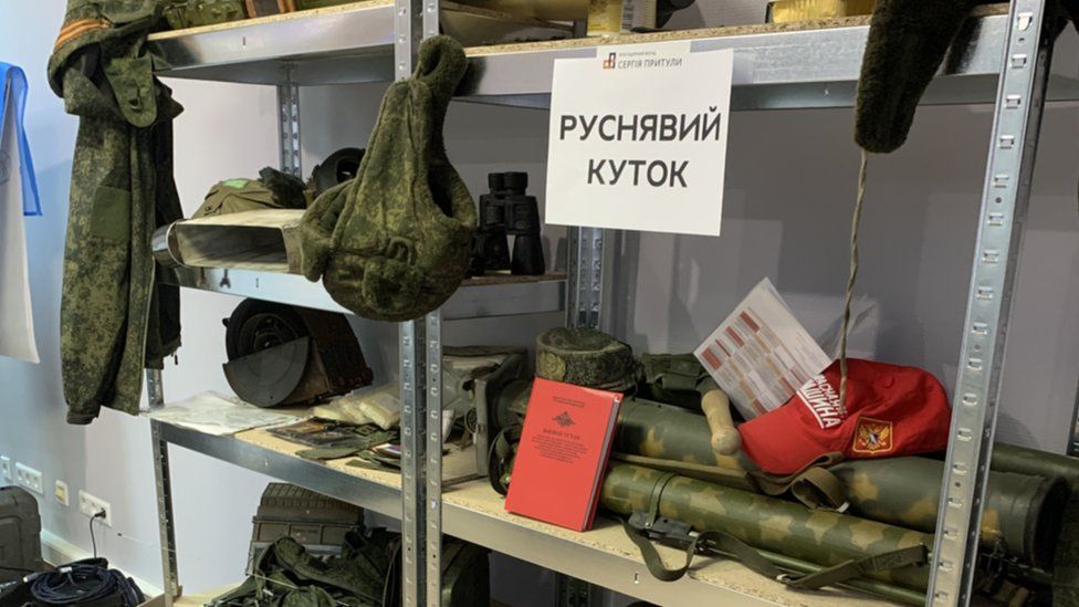 Russian soldiers' equipment on a shelf in a volunteer centre in Kyiv