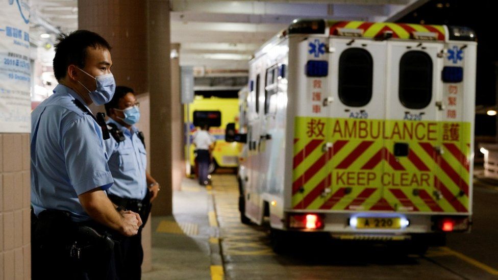 Police stand guard at a public hospital where a man was sent after allegedly stabbing a police officer in Causeway Bay, during the 24th anniversary of the former British colony"s return to Chinese rule and on the 100th founding anniversary of the Communist Party of China, in Hong Kong, China July 1, 2021.