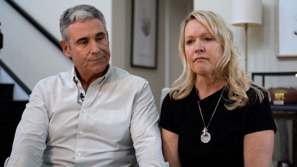 Gena Hoyer pictured crying, alongside her husband Tom