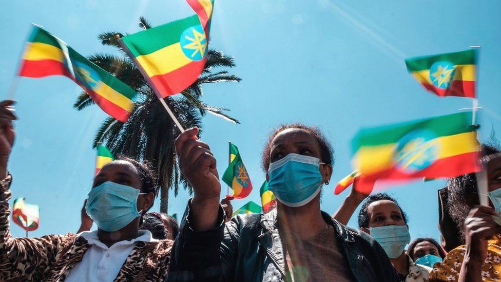 People waving the national flag near the prime minister's office in Addis Ababa