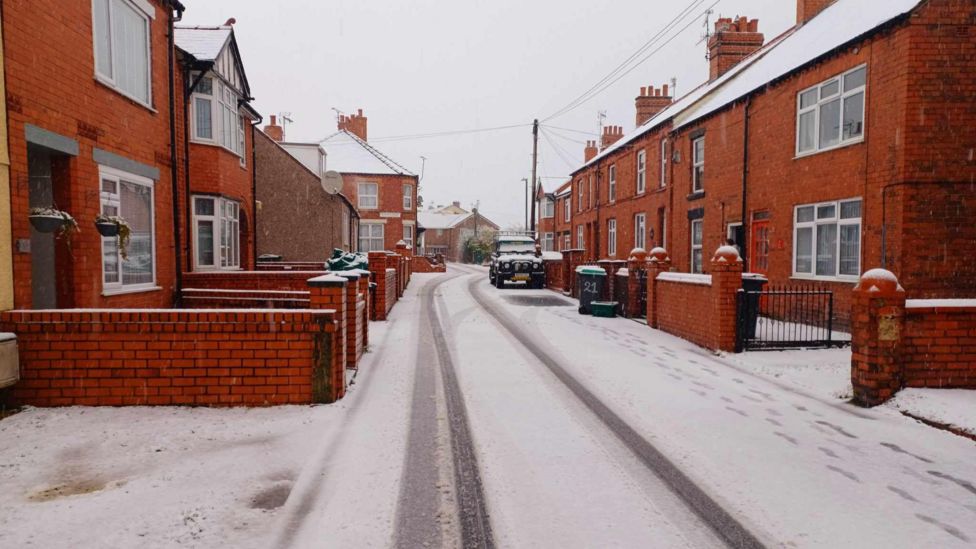 Wales snow warning Flintshire parents' school closure timing anger