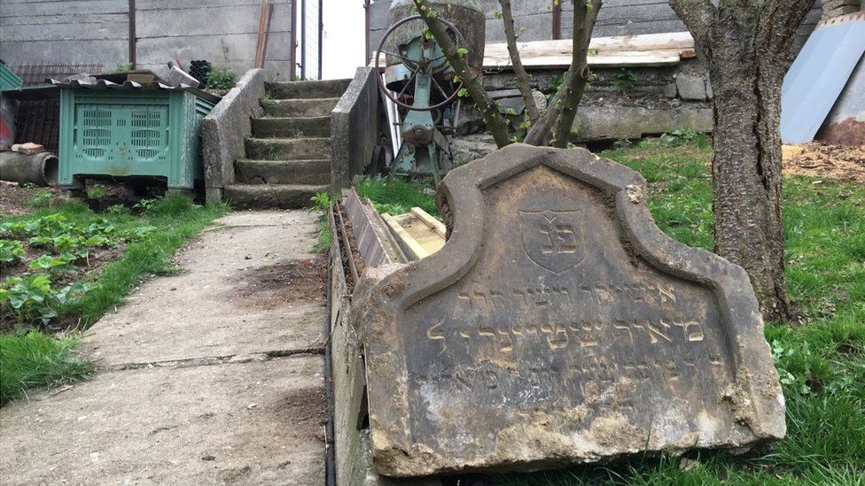 A tombstone lying in a garden in Prostejov