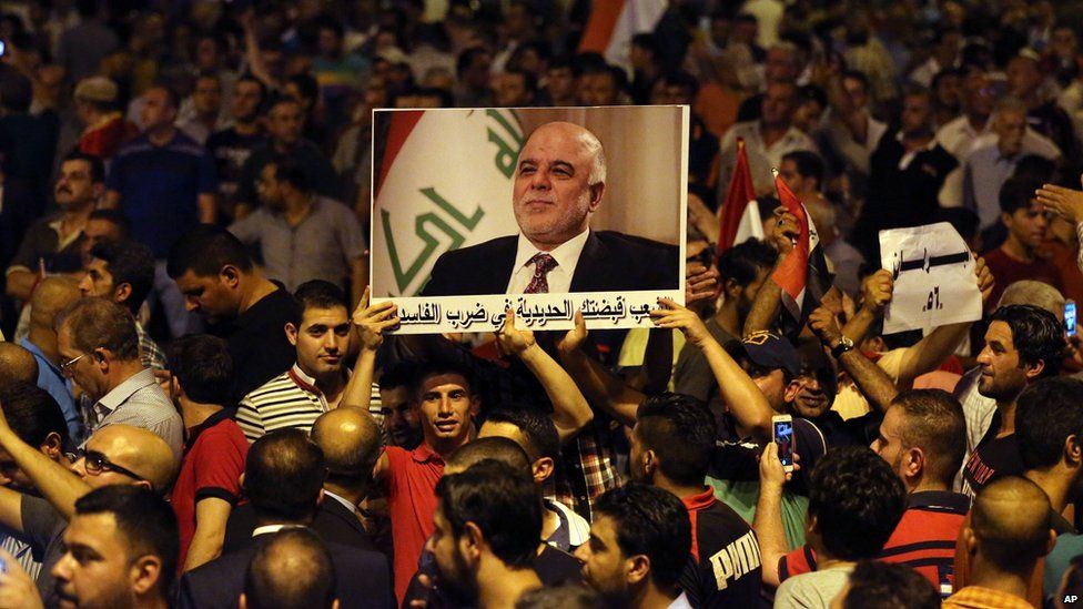 Demonstrators chant in support of Iraqi Prime Minister Haider al-Abadi, during a demonstration at Tahrir Square in Baghdad, on 9 August 2015