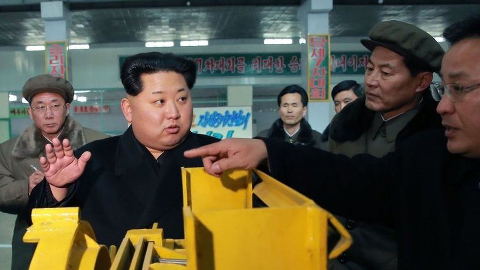 North Korean leader Kim Jong-Un (second left) visiting the Thaesong machine factory in Nampo