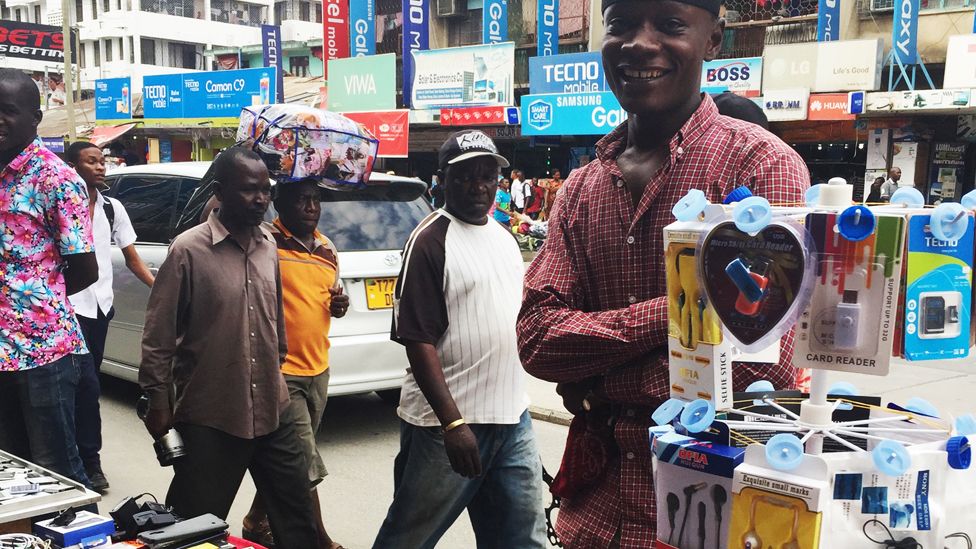 Mohammed, a vendor of mobile phones accessories in Dar es Salaam. Photo: Sammy Awami, BBC Africa