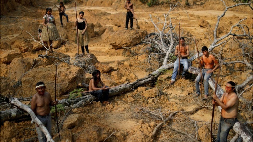 Indigenous people show a deforested area in unmarked indigenous lands inside the Amazon rainforest near Humaita, Amazonas State, Brazil August 20, 2019