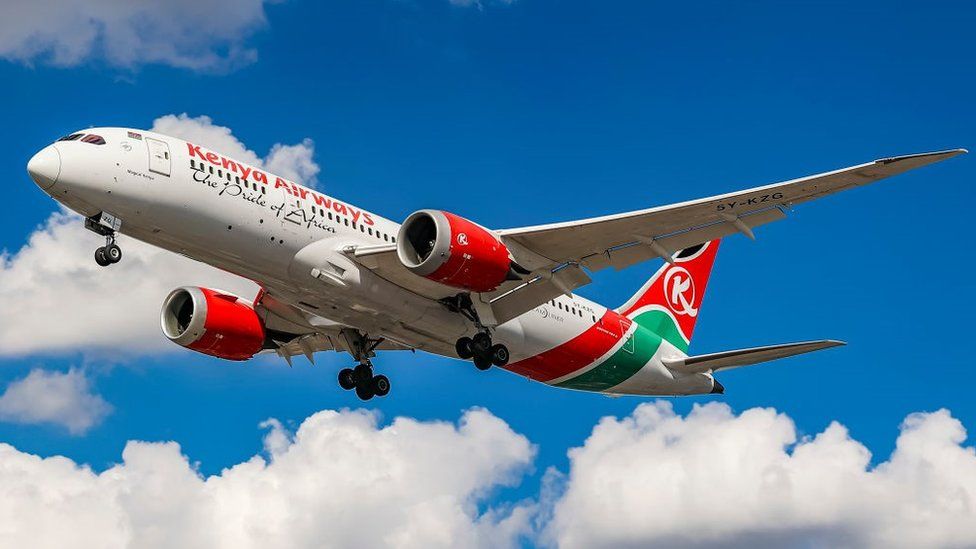 Kenya Airways Boeing 787 Dreamliner aircraft as seen flying for landing at the runway of London Heathrow Airport LHR during a blue sky summer day with some clouds