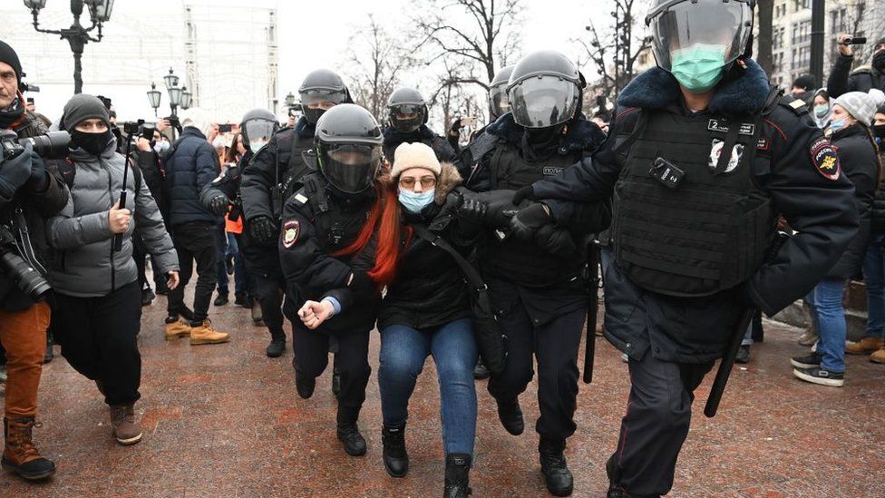 Police detain a woman during a rally in support of jailed opposition leader Alexei Navalny in downtown Moscow on January 23, 2021
