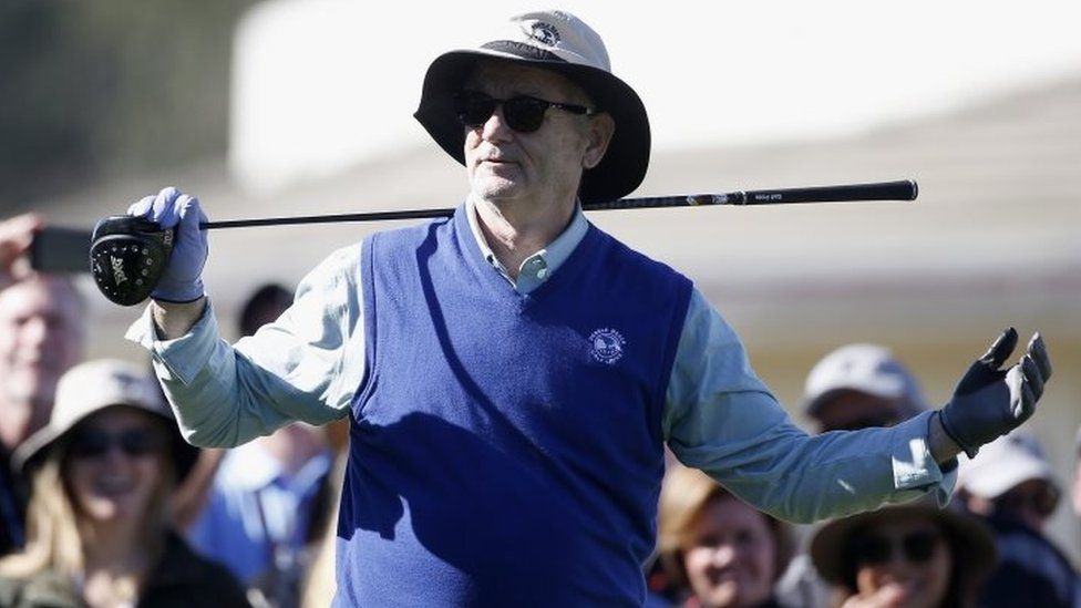 Comedian Bill Murray prepares to tee off on while playing golf in California (10 February 2016)