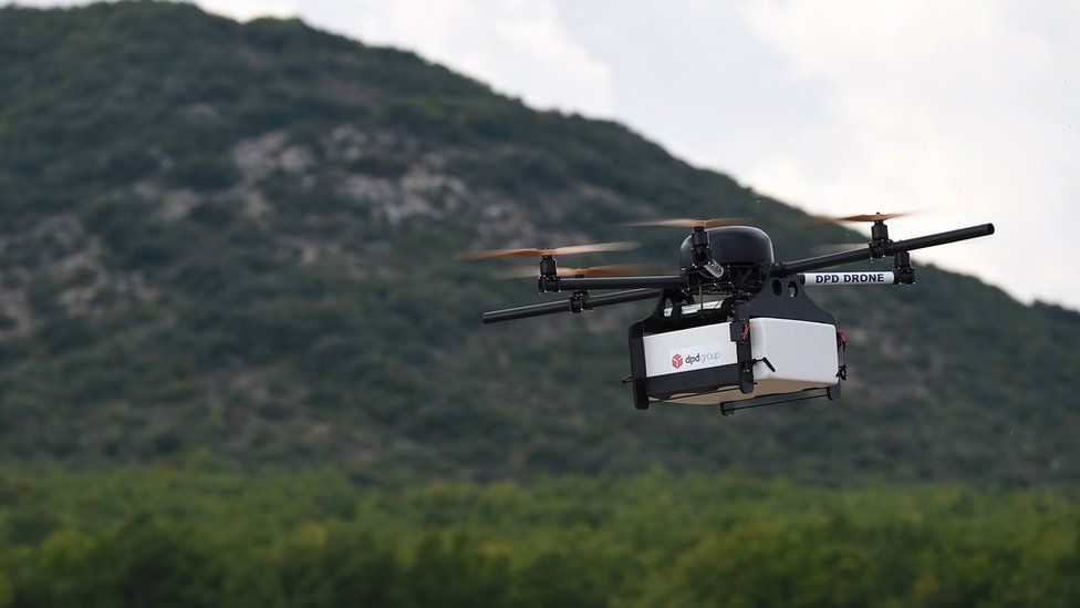 This picture taken on September 28, 2015 shows a Geopost drone flying in Pourrieres, southeastern France, during a presentation of a prototype of a package delivery drone