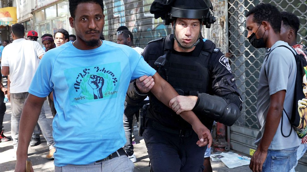 An officer from Israel’s security forces detain an Eritrean asylum-seeker protesting an event organised by Eritrea's government in the coastal city of Tel Aviv, Israel - 2 September 2023