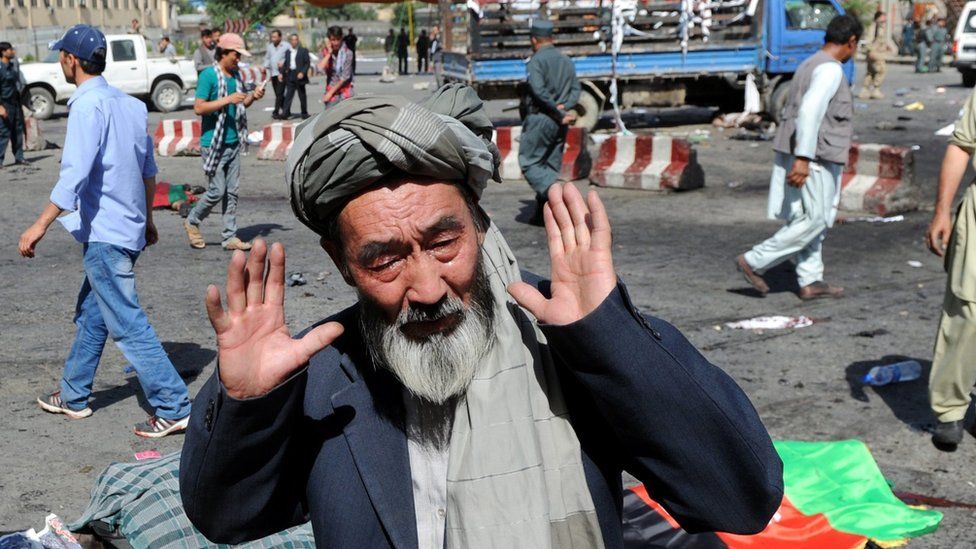 A man from Hazara minority reacts after a suicide bomb attack that targeted a demonstration of Hazara minority in Kabul, Afghanistan, 23 July 2016.