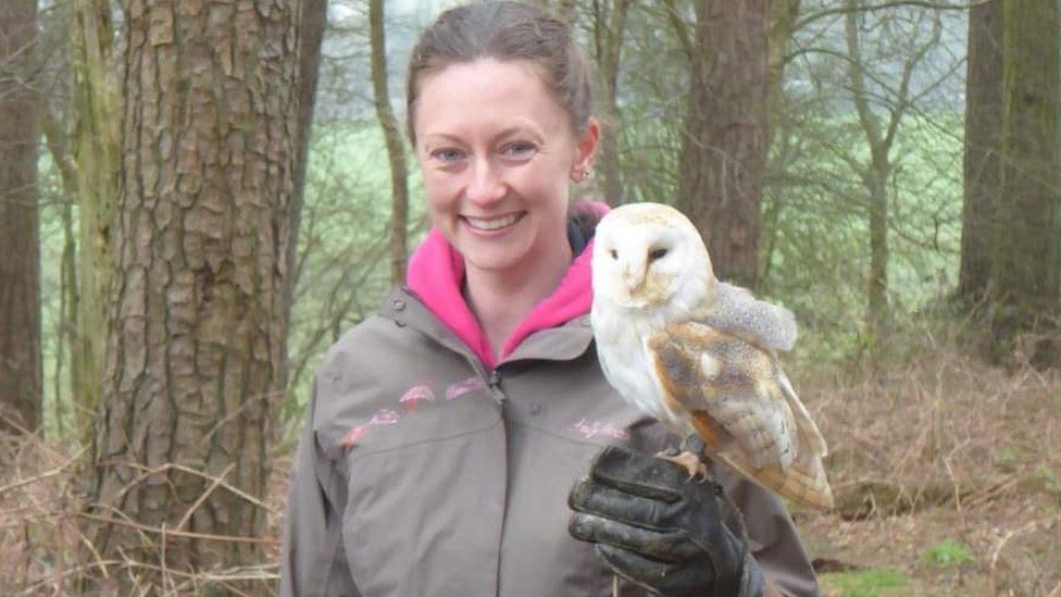 Gemma with an owl on her gloved hand