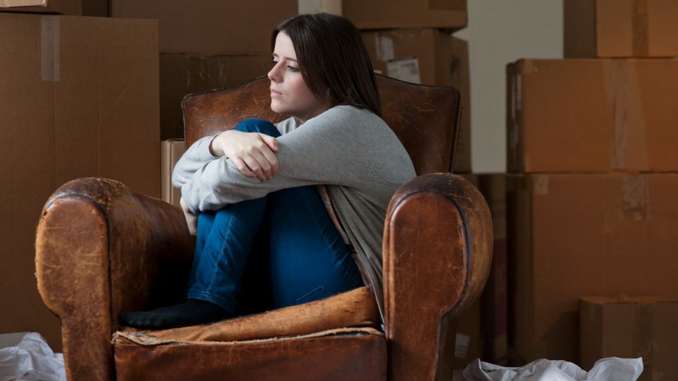 Woman with removal boxes