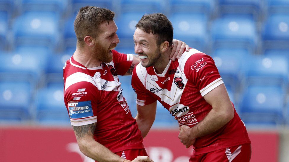 Salford Reds' Marc Sneyd and Ryan Brierley celebrate a try at the Salford Stadium