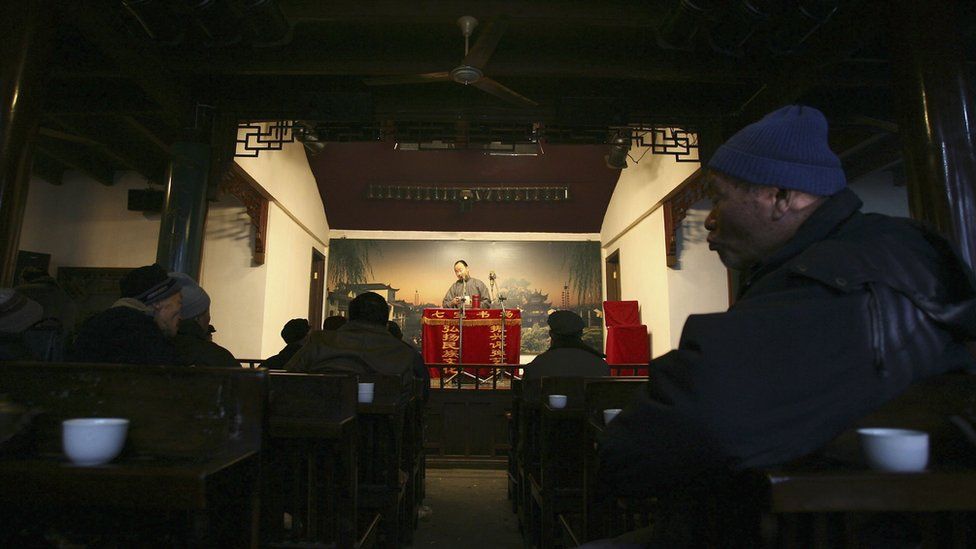 Audience watch and listen to Pingshu performance at a teahouse on February 8, 2006 in Shanghai, China