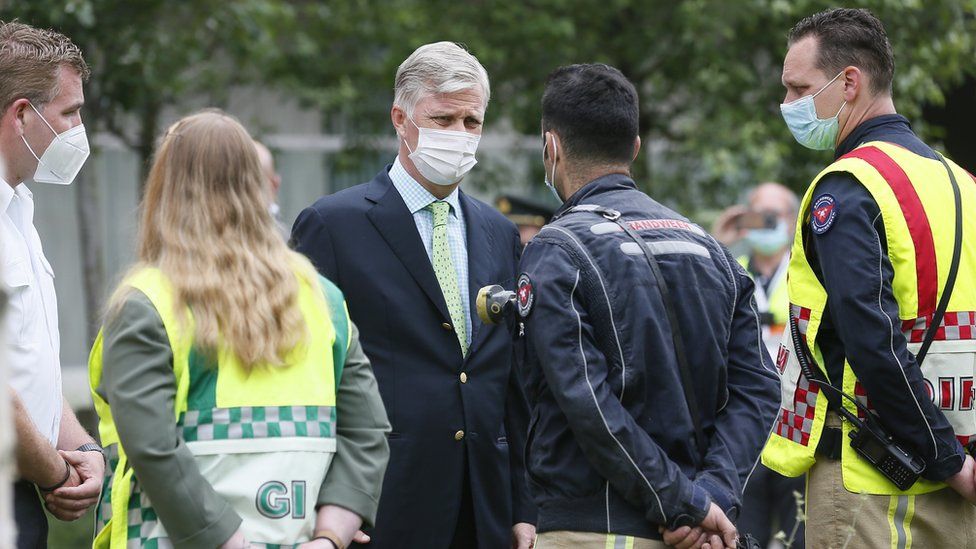 King Philippe of Belgium speaks with rescue workers on site