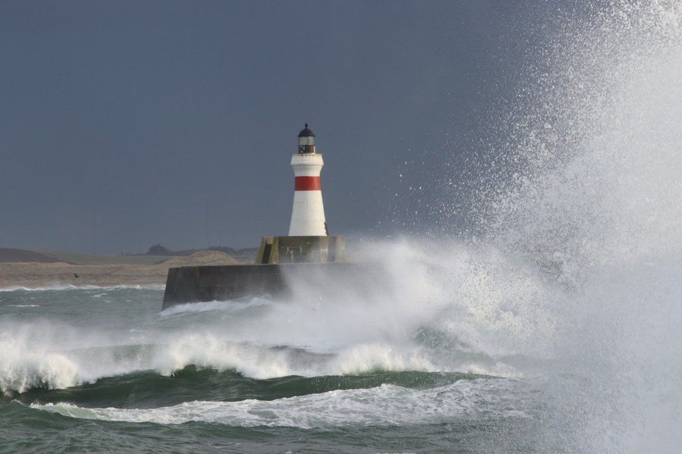 Waves hitting the breakwater at high tide at the Golden Horn in Fraserburgh