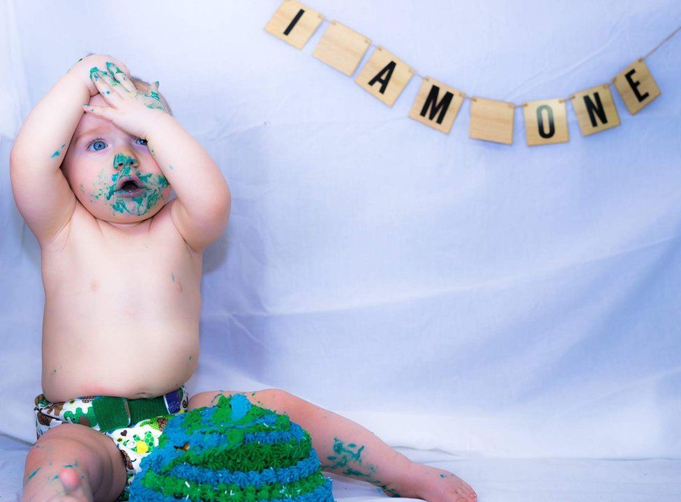 Baby Jared gets stuck into his dairy-free birthday cake