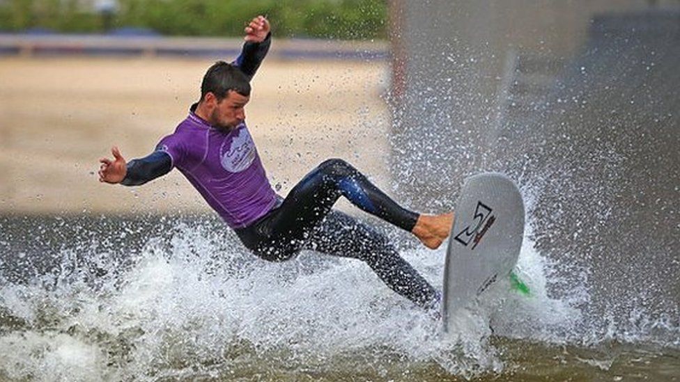 DOLGARROG, WALES - AUGUST 05: Senior Instructor Rick Velk rides a wave at Surf Snowdonia on August 5, 2016 in Dolgarrog, Wales. Surf Snowdonia is the world's first inland surf lagoon featuring pioneering technology which has made an Olympic dream a reality for British surfers. The International Olympic Committee (IOC) has announced its decision to include surfing in the Tokyo 2020 Olympics. The lagoon creates a perfect wave for surfers and was central to the inclusion of surfing in the Olympic Games. Surf Snowdonia will be crucial training facility for first ever surfing Team GB. (Photo by Christopher Furlong/Getty Images)