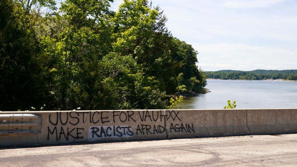 Graffiti seen on the causeway near the property where Vauhxx Booker says he was assaulted at Monroe Lake