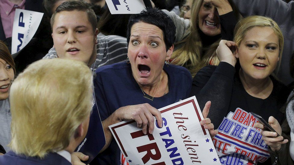 A woman reacts to seeing Donald Trump at a rally during his presidential campaign