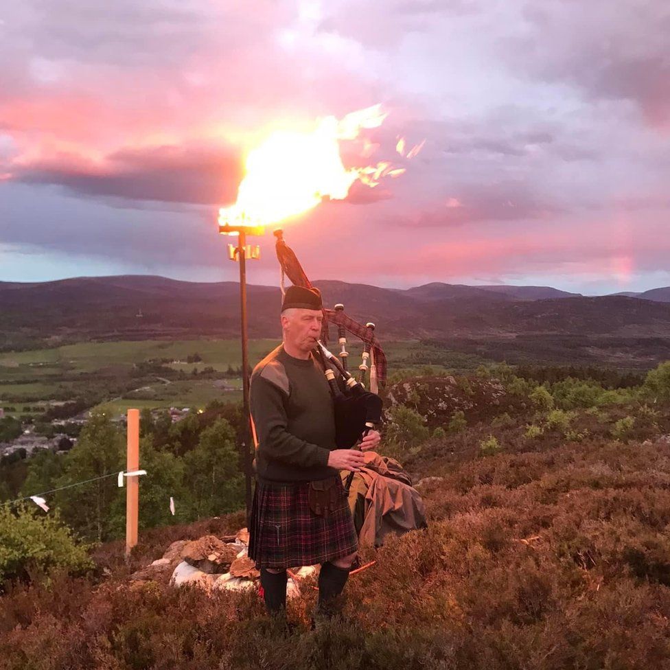 Sandy MacDonell piped at Ceag Bheag, Kingussie, during the lighting of the beacon.