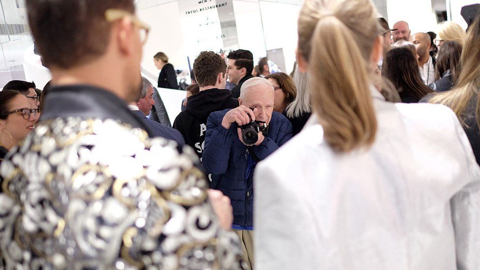 Bill Cunningham photographs at a fashion event in New York in 2016